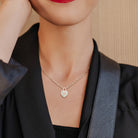 Pink morganite heart pendant necklace in sterling silver worn on model, lifestyle view by Delmar