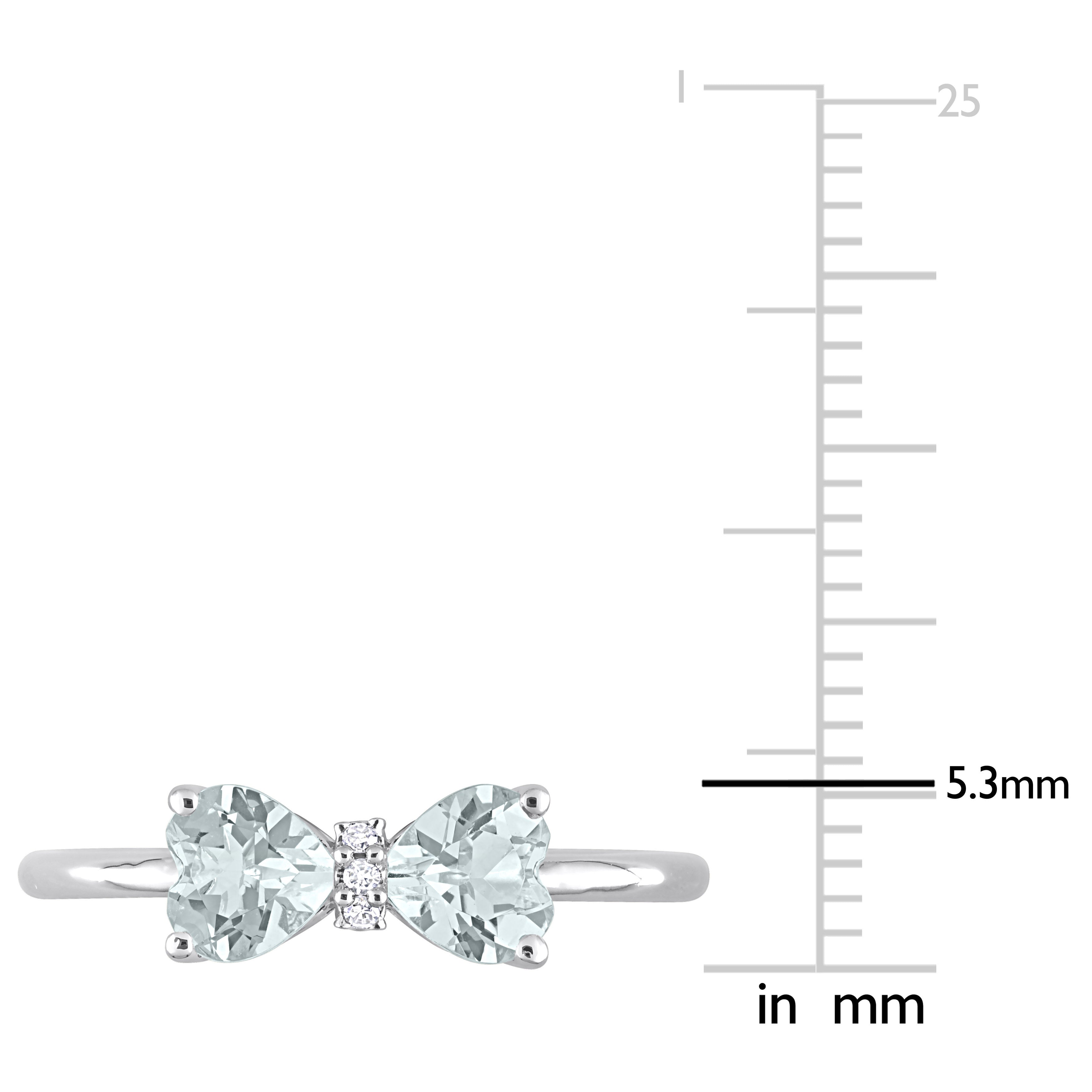 Close-up of heart-cut aquamarine and bezel-set diamonds on sterling silver ring by Lord & Taylor