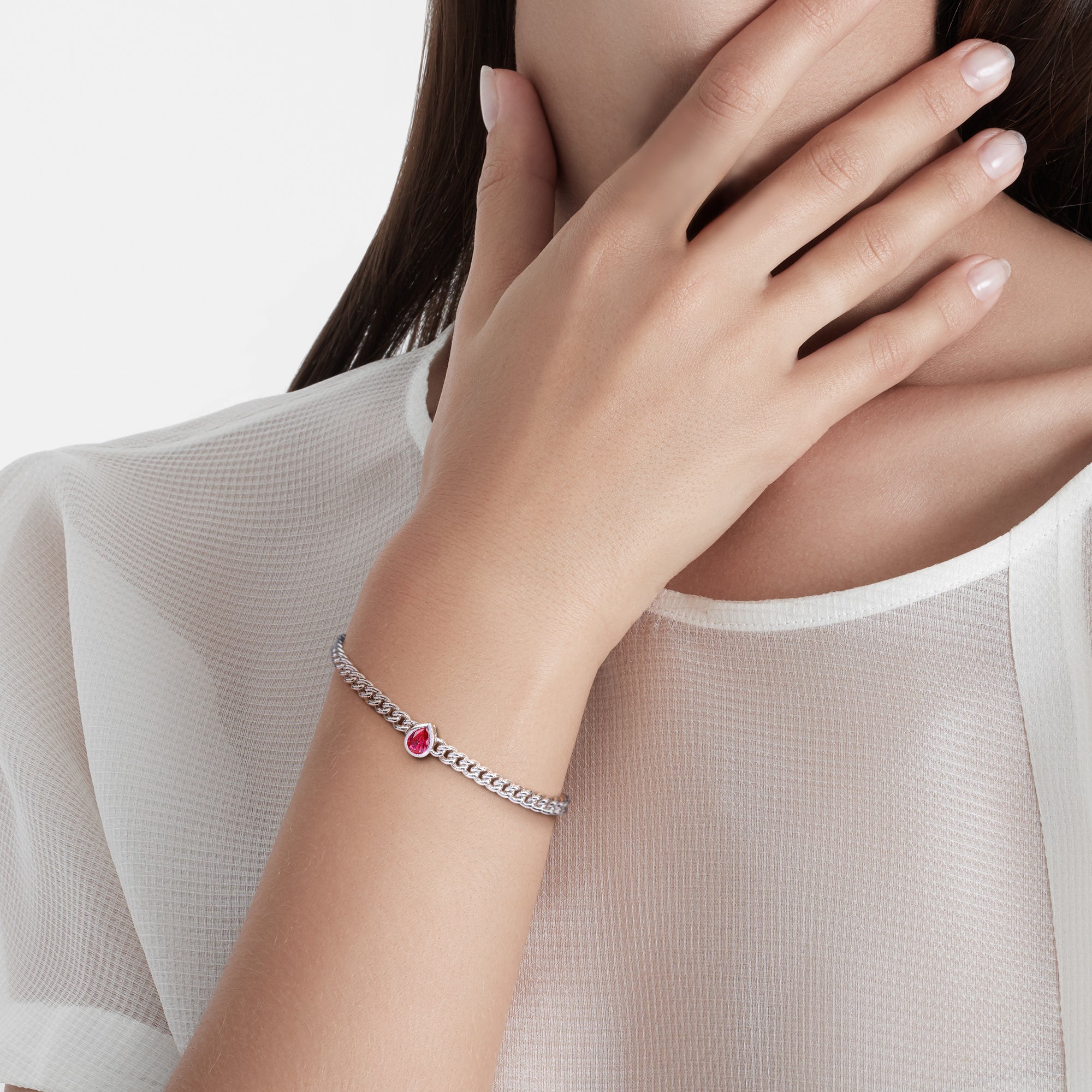 Sterling silver ruby bracelet worn on wrist, lifestyle view by Lord & Taylor