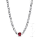 Close-up of 7mm round created ruby in bezel mount on sterling silver chain