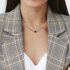 Sterling silver gemstone necklace with created ruby worn on model