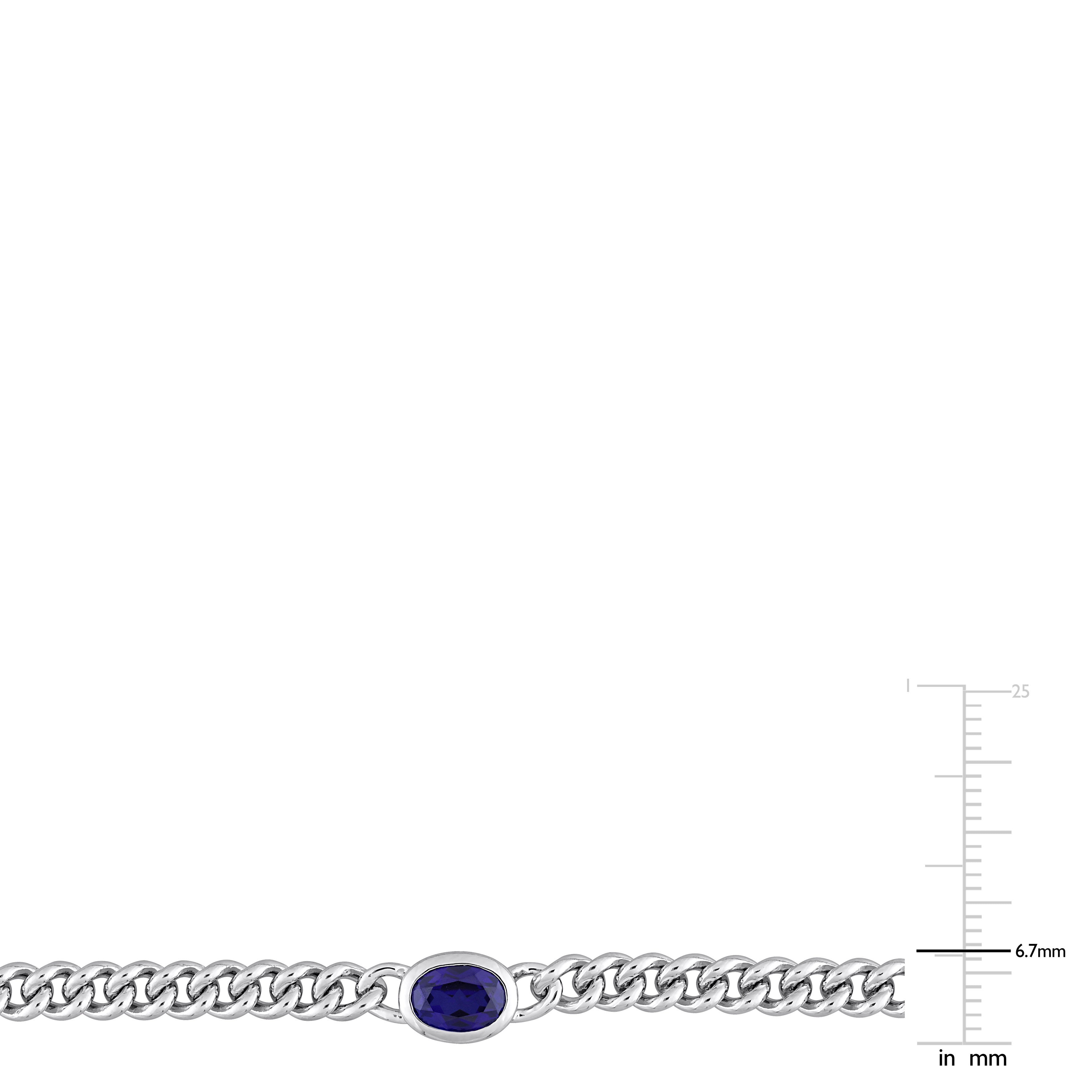 Sterling silver flat curb chain with blue sapphire pendant, side angle view