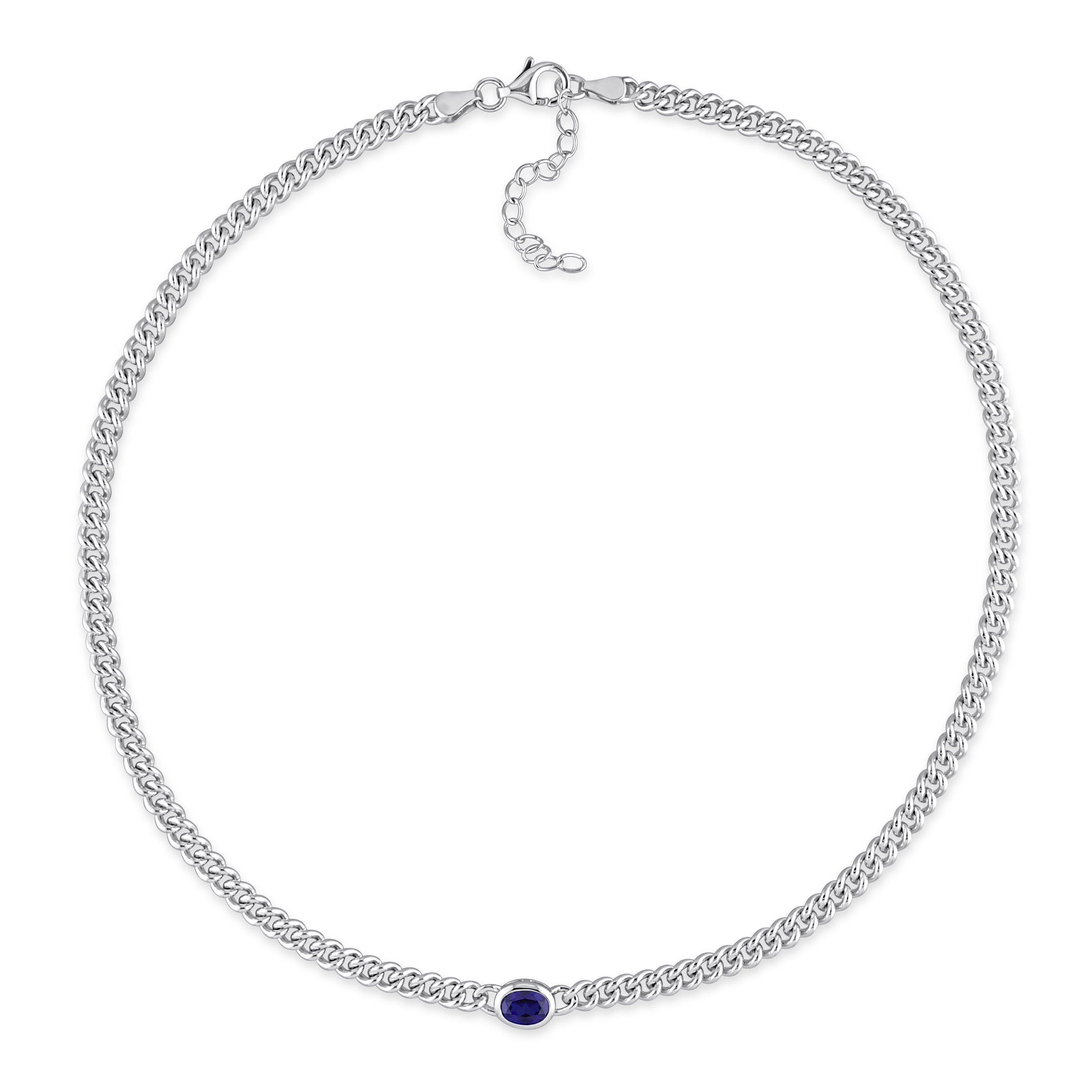 Blue sapphire pendant necklace by Delmar, detail view of bezel setting