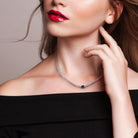 Blue sapphire sterling silver necklace by Delmar worn on model
