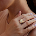 Yellow-plated silver diamond heart ring worn on hand by Lord & Taylor