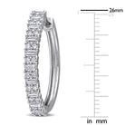 Close-up of baguette and round-cut moissanite stones in sterling silver hoop earring by Delmar