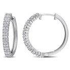 Sterling silver moissanite hoop earrings with alternating baguette and round cuts by Delmar, front view