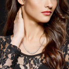 White moissanite graduated tennis necklace worn, lifestyle view