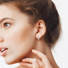 Sterling silver multi-row moissanite hoop earrings worn, lifestyle view by Lord & Taylor