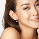 Sterling silver moissanite hoop earrings worn, lifestyle view