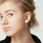 Pink topaz and ruby drop earrings worn, lifestyle view by Lord & Taylor