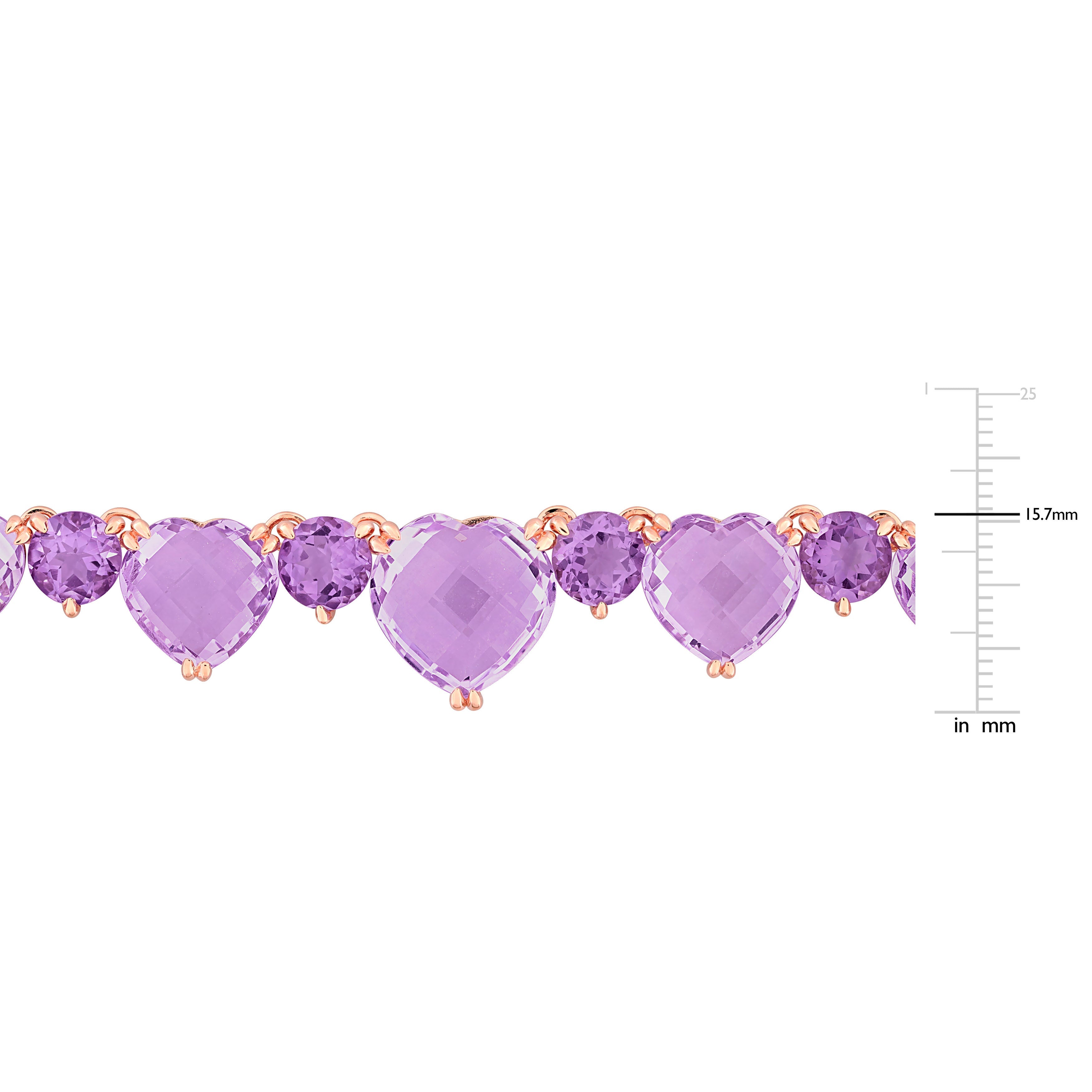 Close-up of heart-shaped pink amethyst gemstone with round amethyst accents by Lord & Taylor