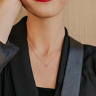 Rose-plated heart pendant necklace worn, lifestyle view by Delmar