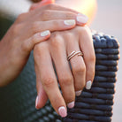 Sterling silver double curved moissanite ring by Lord & Taylor, worn on hand