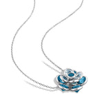 Blue topaz flower pendant necklace showing floral gemstone arrangement detail