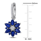 Close-up of created blue sapphire and diamond flower detail on hoop earring