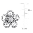 Close-up of diamond center and floral petal detailing on sterling silver earring