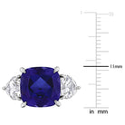 Blue sapphire three-stone ring in sterling silver by Lord & Taylor, close-up of gemstones
