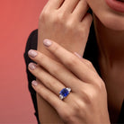Blue sapphire three-stone ring in sterling silver by Lord & Taylor, worn on hand