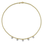 Yellow-plated heart station necklace with lobster claw clasp, detail view by Lord & Taylor