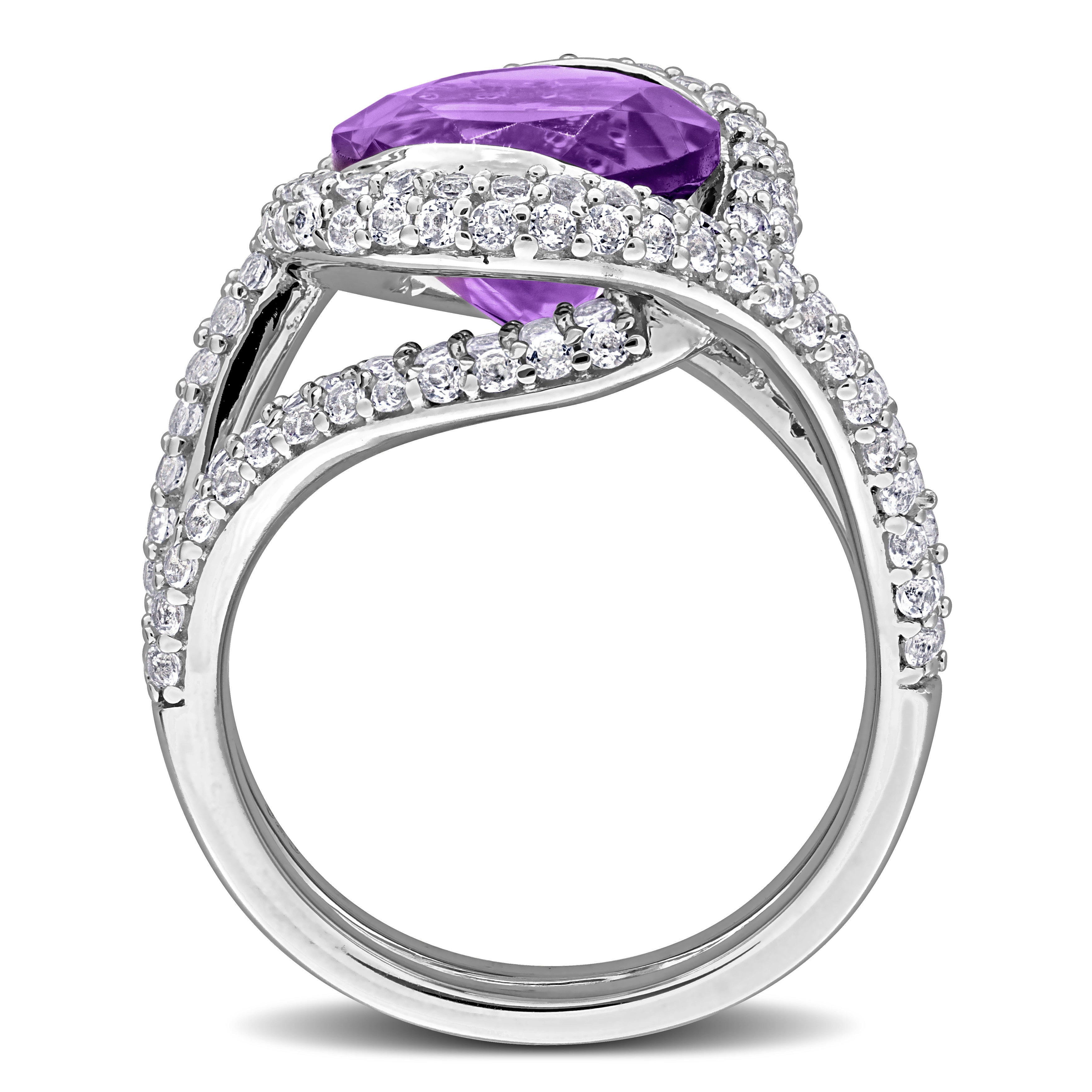 Purple amethyst cocktail ring with white topaz accents, diagonal overhead view