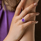 Purple amethyst crossover ring worn on hand, lifestyle view