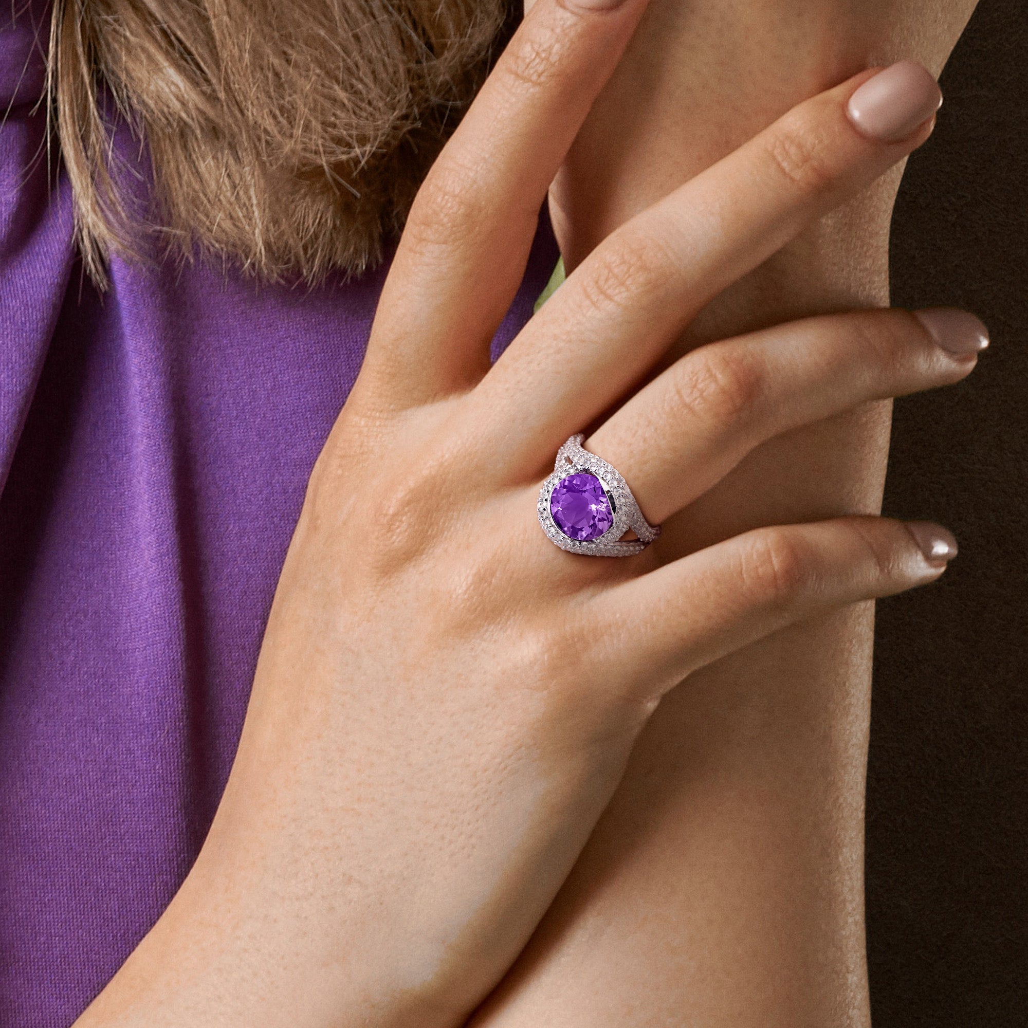 Purple amethyst crossover ring worn on hand, lifestyle view