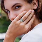 Green quartz crossover ring worn on hand, lifestyle view