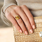 Yellow citrine cocktail ring worn on hand by Lord & Taylor