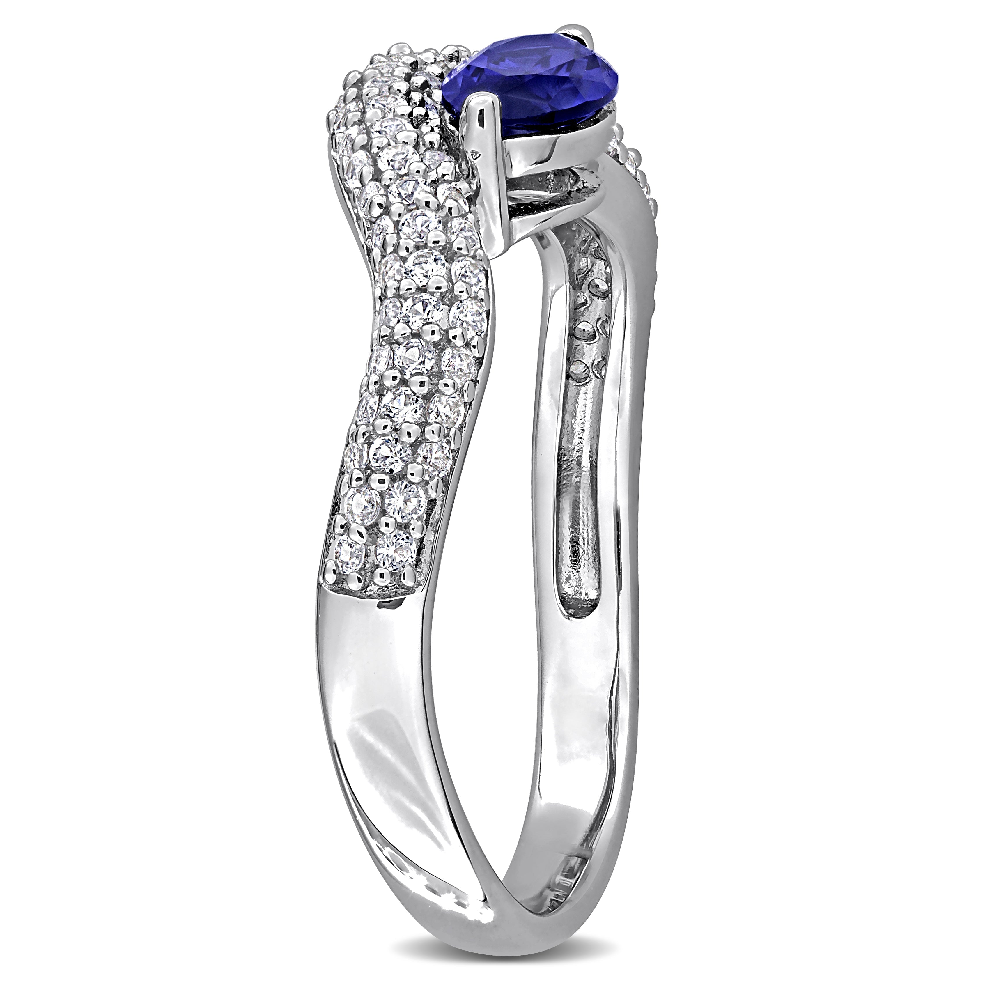 Blue sapphire curved ring in sterling silver, back view showing polished band by Lord & Taylor