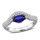 Blue sapphire curved ring in sterling silver with white sapphires, front view by Lord & Taylor
