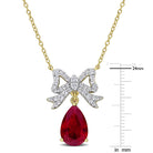 Close-up of bow pendant showing created ruby and white sapphire arrangement with high polish finish
