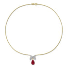 Yellow-plated bow necklace with created gemstones, detail view of pendant
