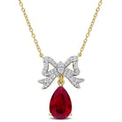 Yellow-plated sterling silver bow necklace with ruby and sapphire gemstones, front view by Delmar