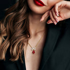 Yellow-plated sterling silver bow necklace worn, showing 17-inch length
