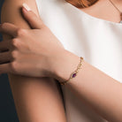 Yellow-plated sterling silver amethyst bracelet by Lord & Taylor worn on wrist, lifestyle view