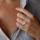Sterling silver diamond crossover ring worn on hand by Lord & Taylor