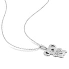 Sterling silver dog pendant necklace detail showing diamond accents and two-tone finish