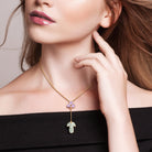 Yellow gold plated quartz pendant necklace worn, lifestyle view by Lord & Taylor