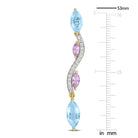 Close-up of yellow-plated sterling silver earring with three gemstones and butterfly back closure