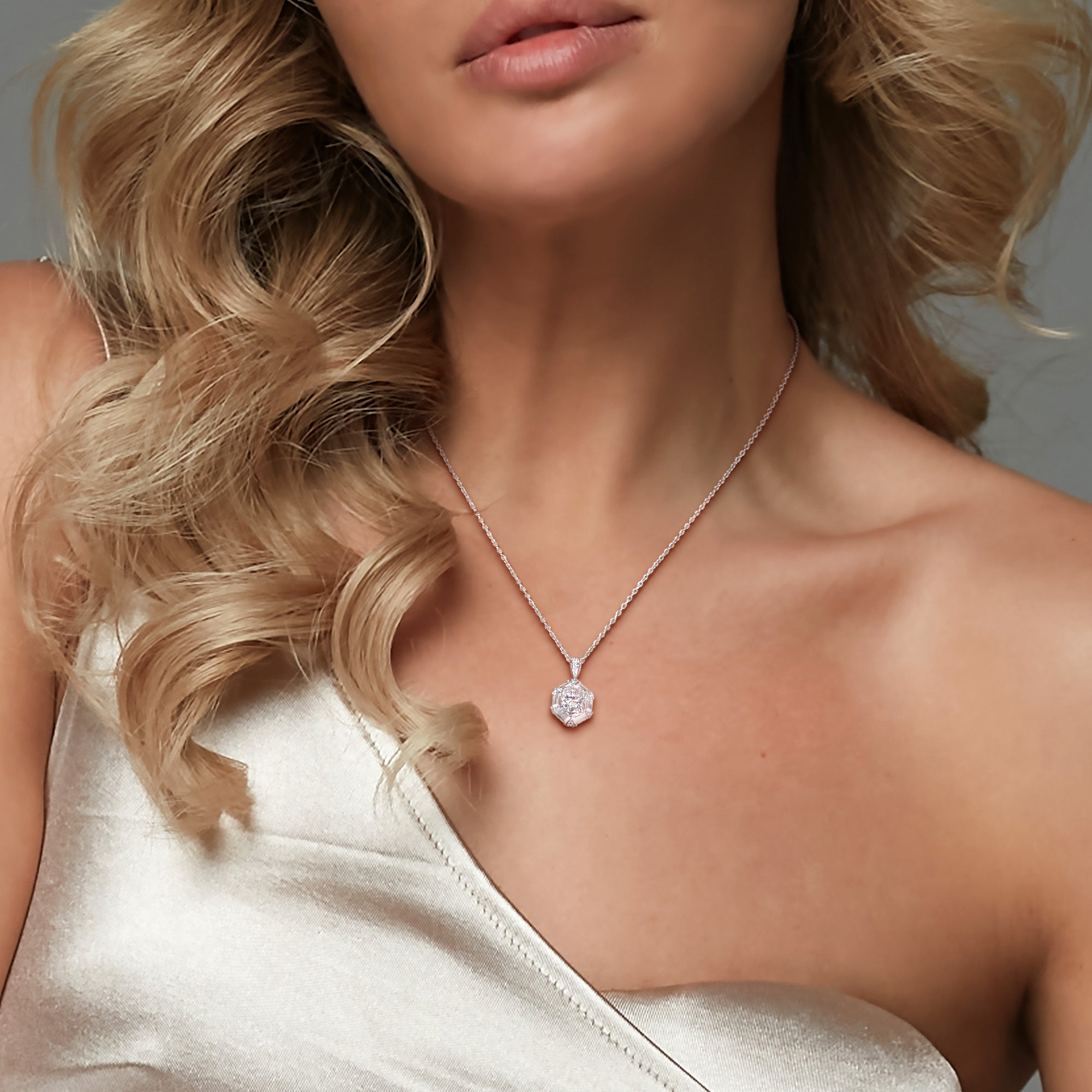 Sterling silver moissanite drop pendant necklace worn, lifestyle view