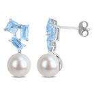 Cultured freshwater pearl earrings with blue topaz gemstones in 10k white gold, detail view