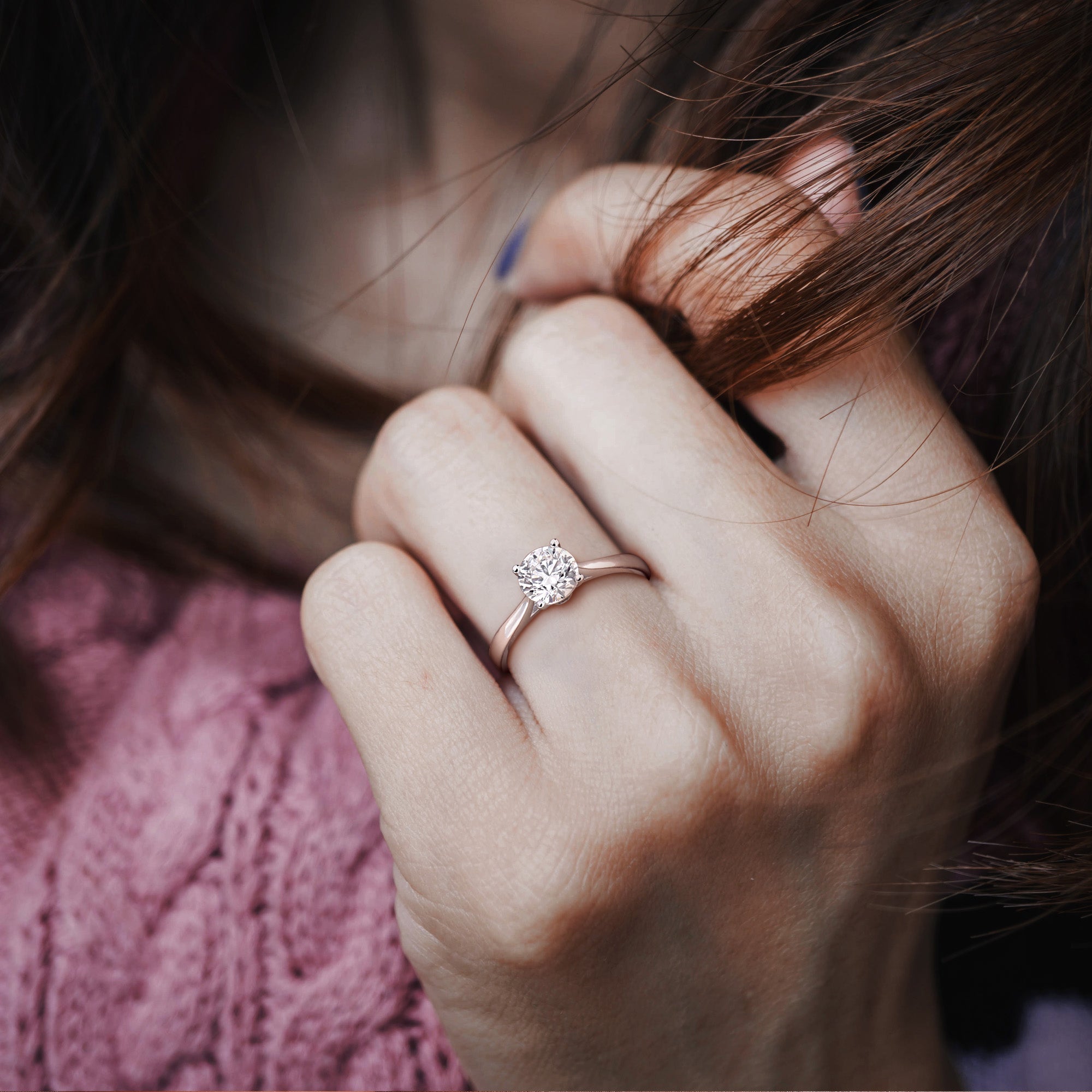 Lab-grown diamond solitaire engagement ring worn on hand by Lord & Taylor