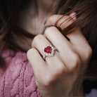 Red ruby heart halo ring worn on hand, lifestyle view
