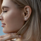 Lab-grown diamond stud earrings worn, lifestyle view by Lord & Taylor