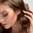 Lab-grown diamond cluster stud earrings worn, lifestyle view by Lord & Taylor