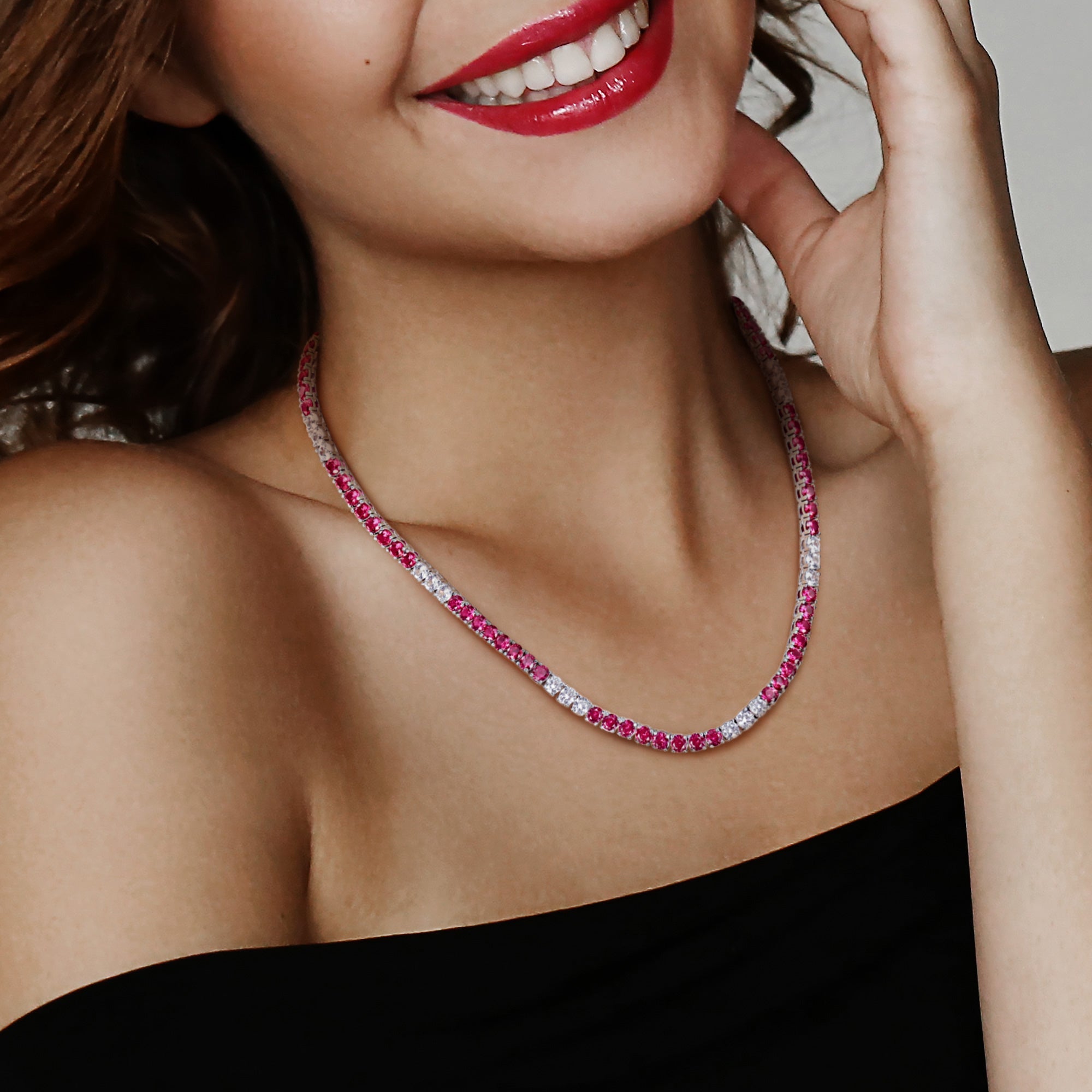 Red and white tennis necklace worn on model by Lord & Taylor