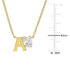 Yellow-plated initial pendant close-up showing created white sapphire stones by Lord & Taylor