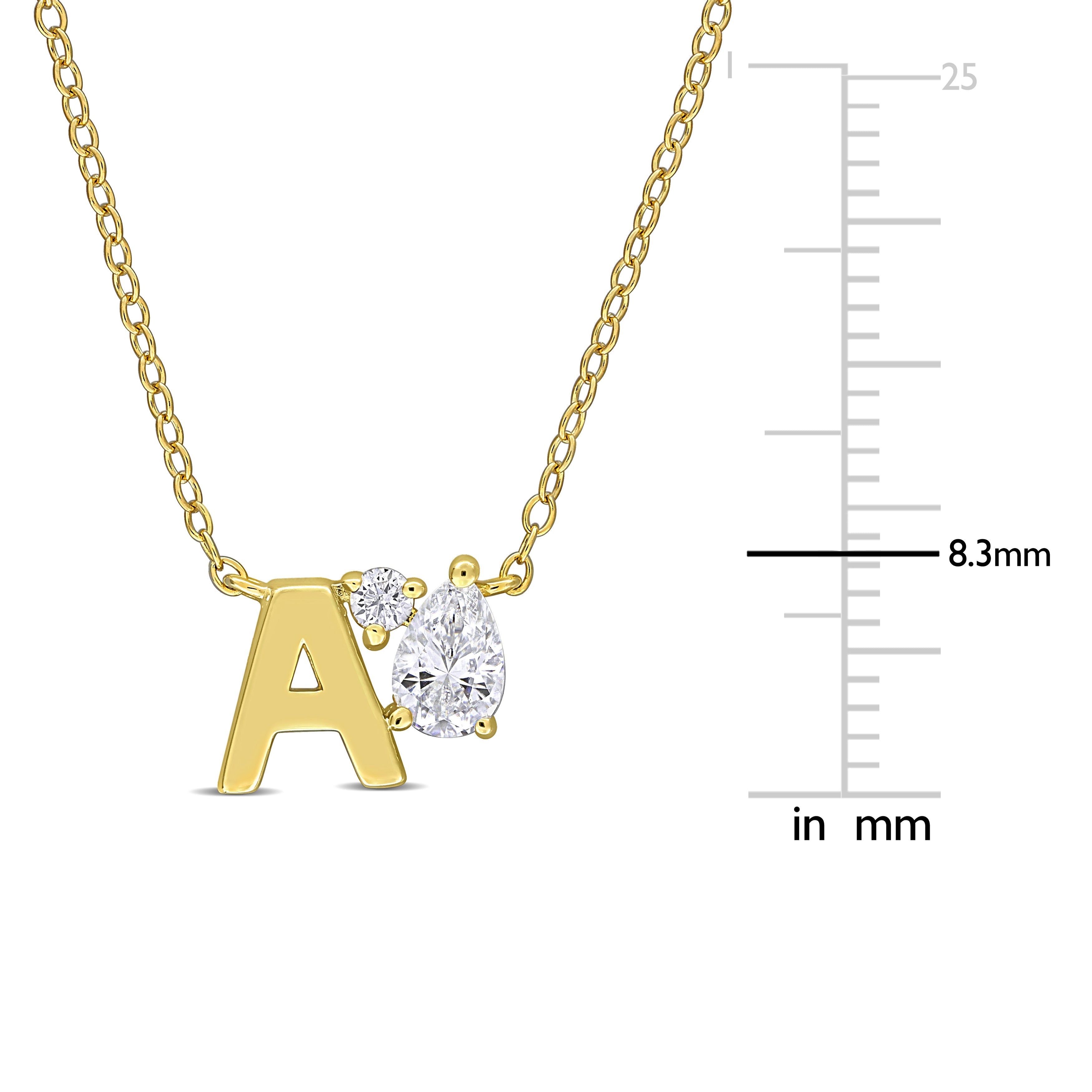 Yellow-plated initial pendant close-up showing created white sapphire stones by Lord & Taylor