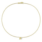 Yellow-plated initial pendant necklace detail view showing pear-cut sapphire by Lord & Taylor